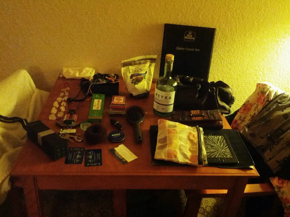 My travel belongings laid out on my side of the room