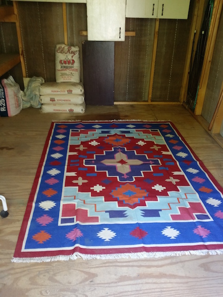  After emptying most of the shed, all that is left is Chuck's El Rey stucco (maybe pink). A rug to make things homier. 