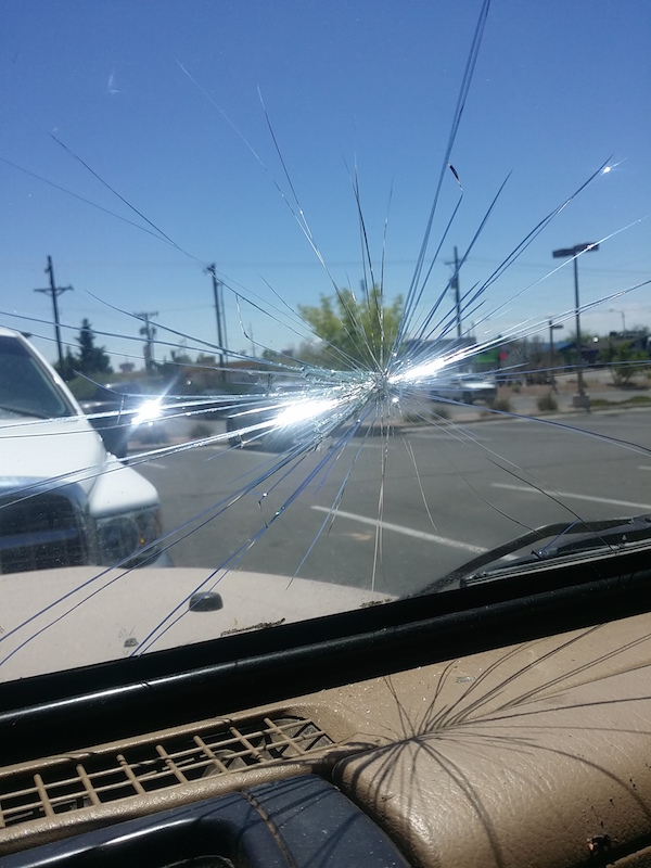  Overzealously loading redwood planks into the Jeep, I cracked the windshield. 
