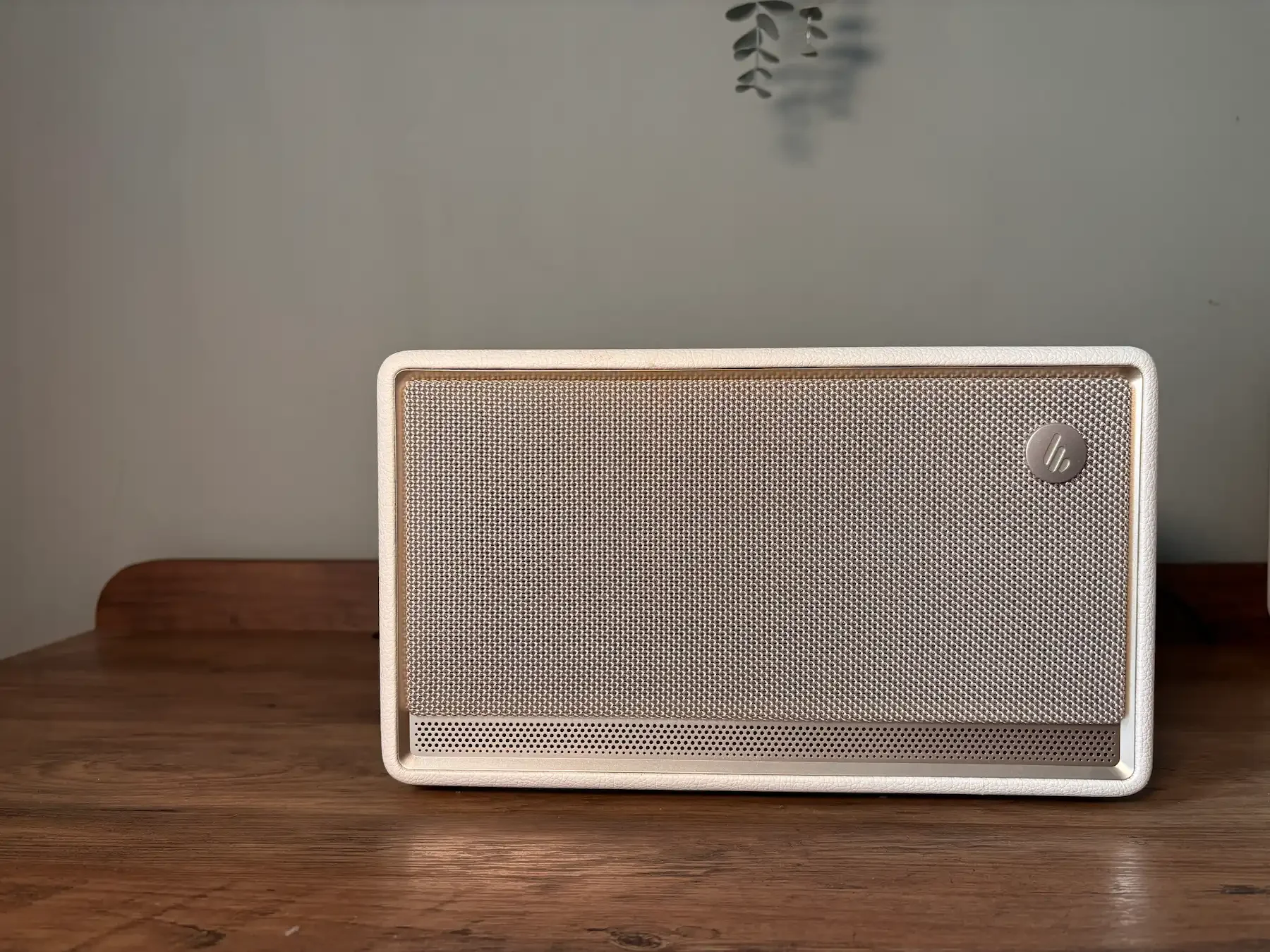 Edifier ES300 speaker in ivory showing the front grille, logo and premium tabletop design