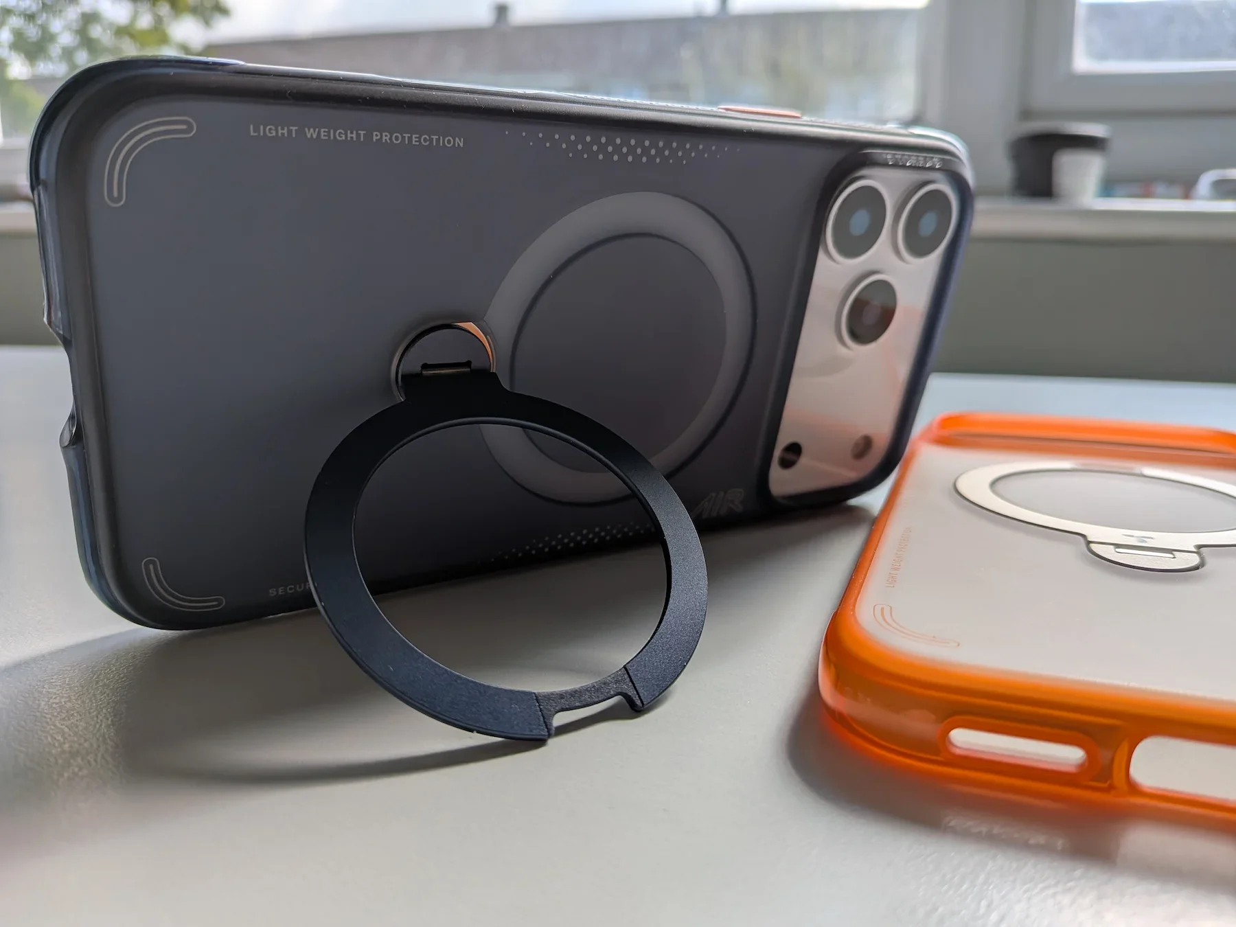 TORRAS Ostand Q3 Air case fitted on the iPhone 17 Pro Max with the rotating stand open in landscape mode for hands-free viewing.