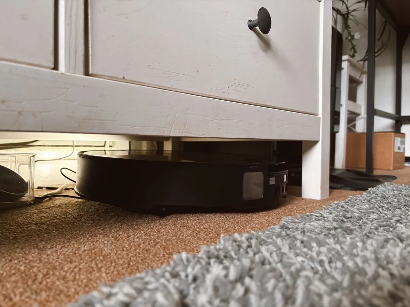 Roborock Saros 10 cleaning under low furniture with lowered LiDAR