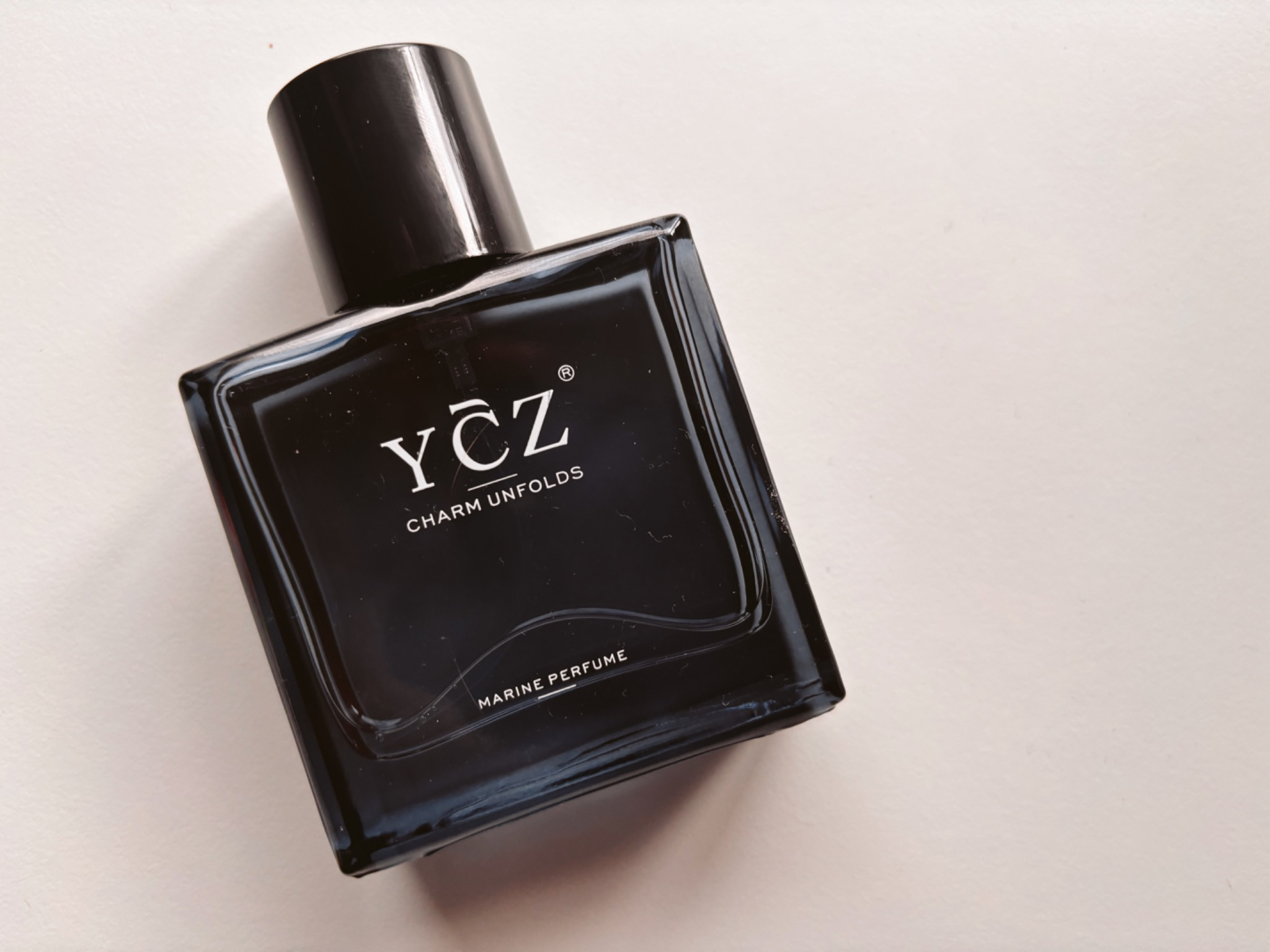 YCZ Midnight marine perfume bottle photographed on a clean white background