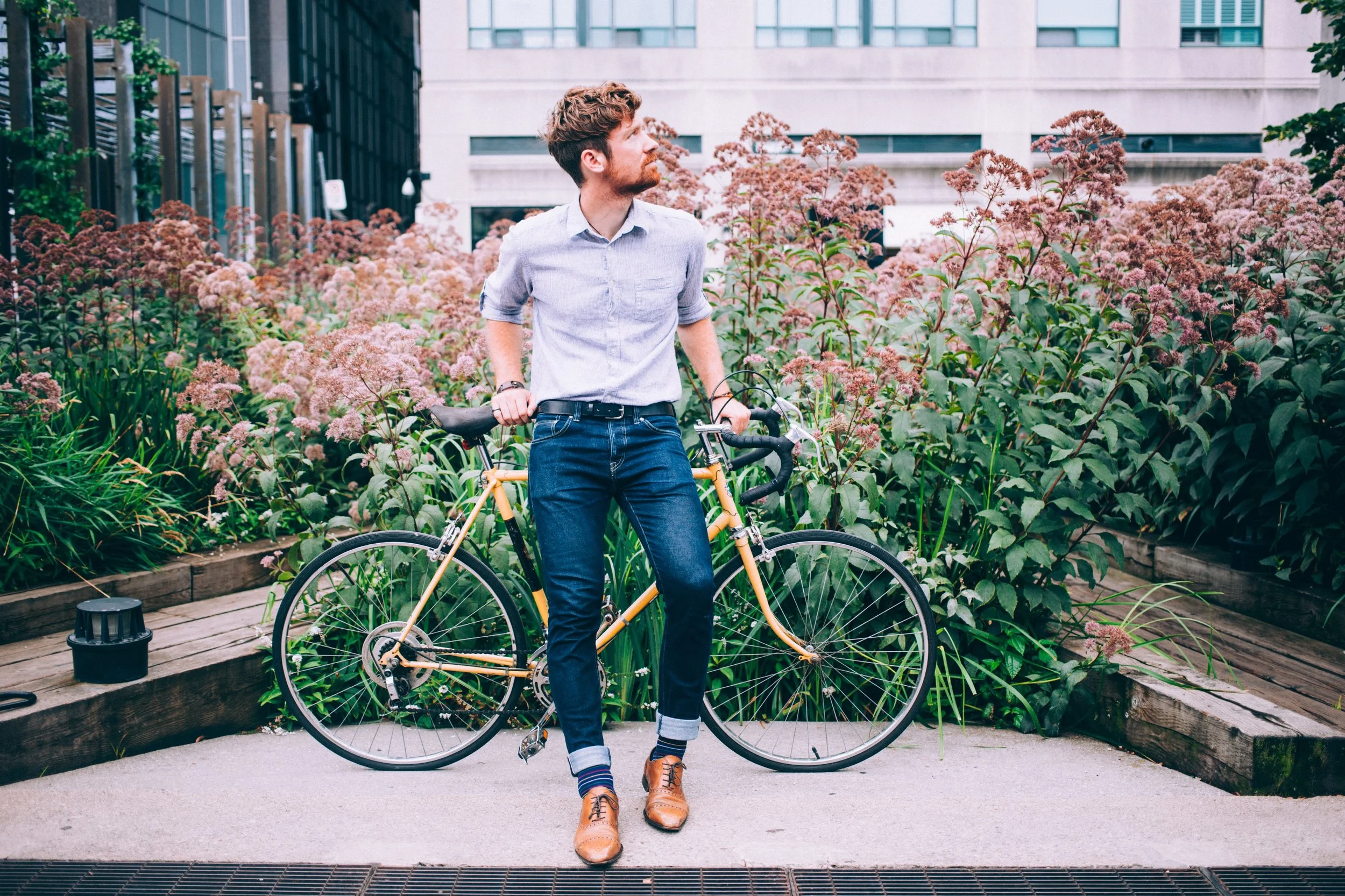 mens-fashion-man-in-shirt-and-jeans-leaning-on-bicycle_4460x4460.jpg