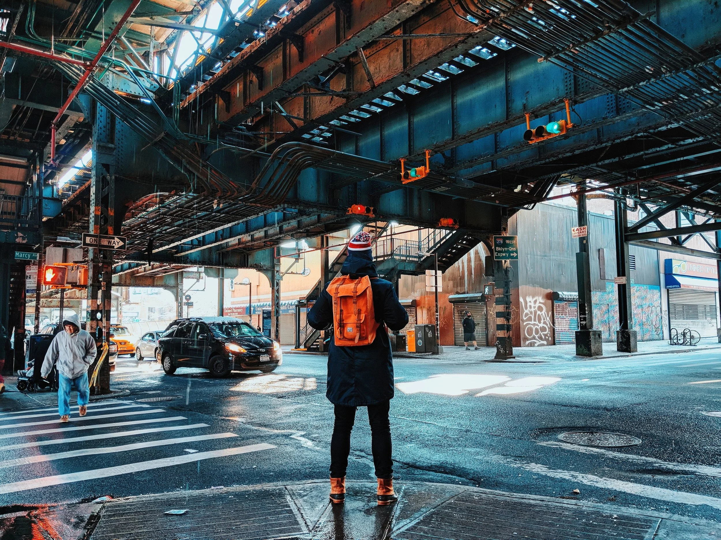 traveller-in-nyc-with-backpack-under-bridge_4460x4460.jpg
