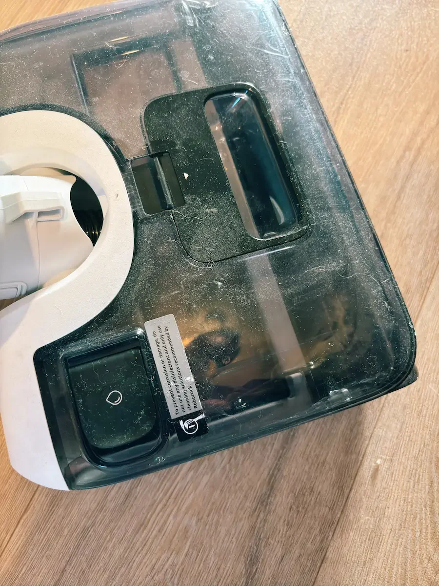 Close-up of the Roborock F25 GT clean water tank and cleaning solution compartment during testing.