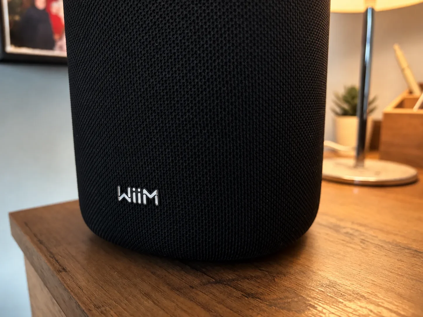 Close-up of the black fabric grille and WiiM logo on the Sound Lite speaker