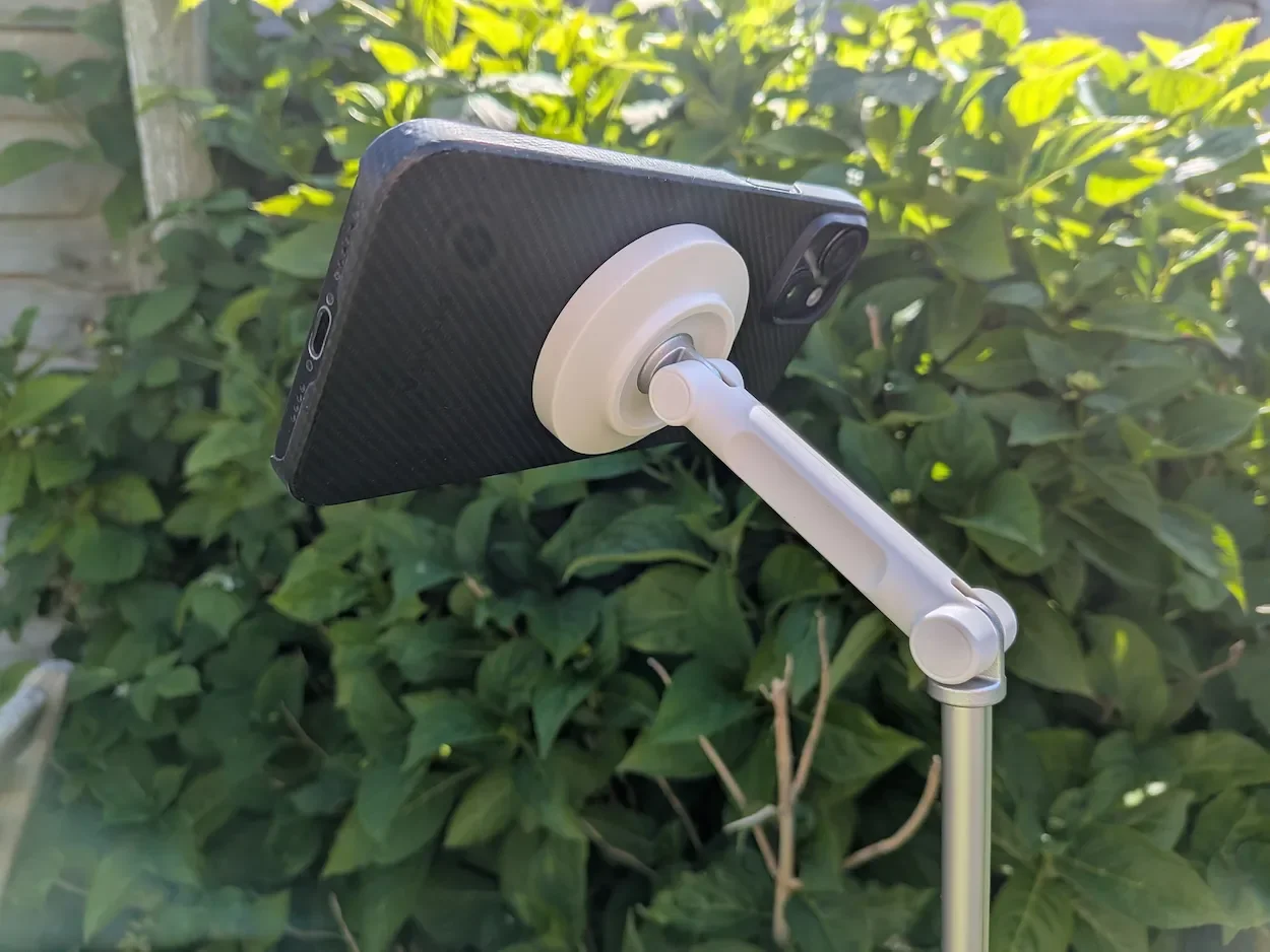 KraftGeek JustTap Magnetic Phone Tripod holding an iPhone outdoors during real-world testing for a content creation review.
