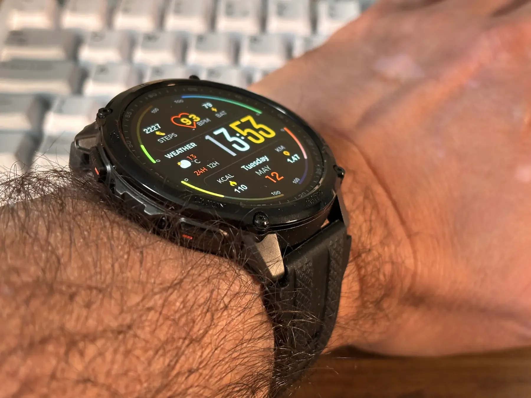 Jerome working at his desk wearing the Kospet Tank T4C Smartwatch