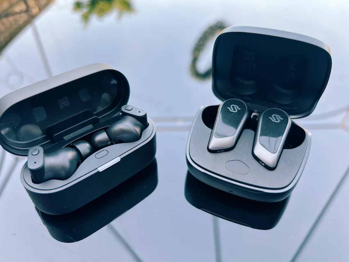 Open charging cases showing the Edifier STAX Spirit S10 and Status Audio Pro X earbuds.