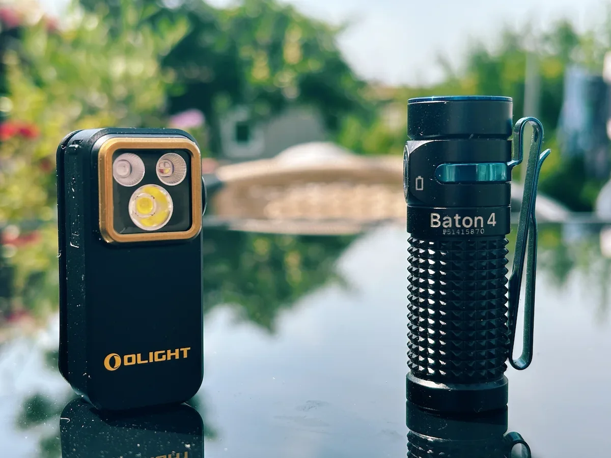 Olight Oclip Pro S placed next to the Olight Baton 4 for a size and design comparison.
