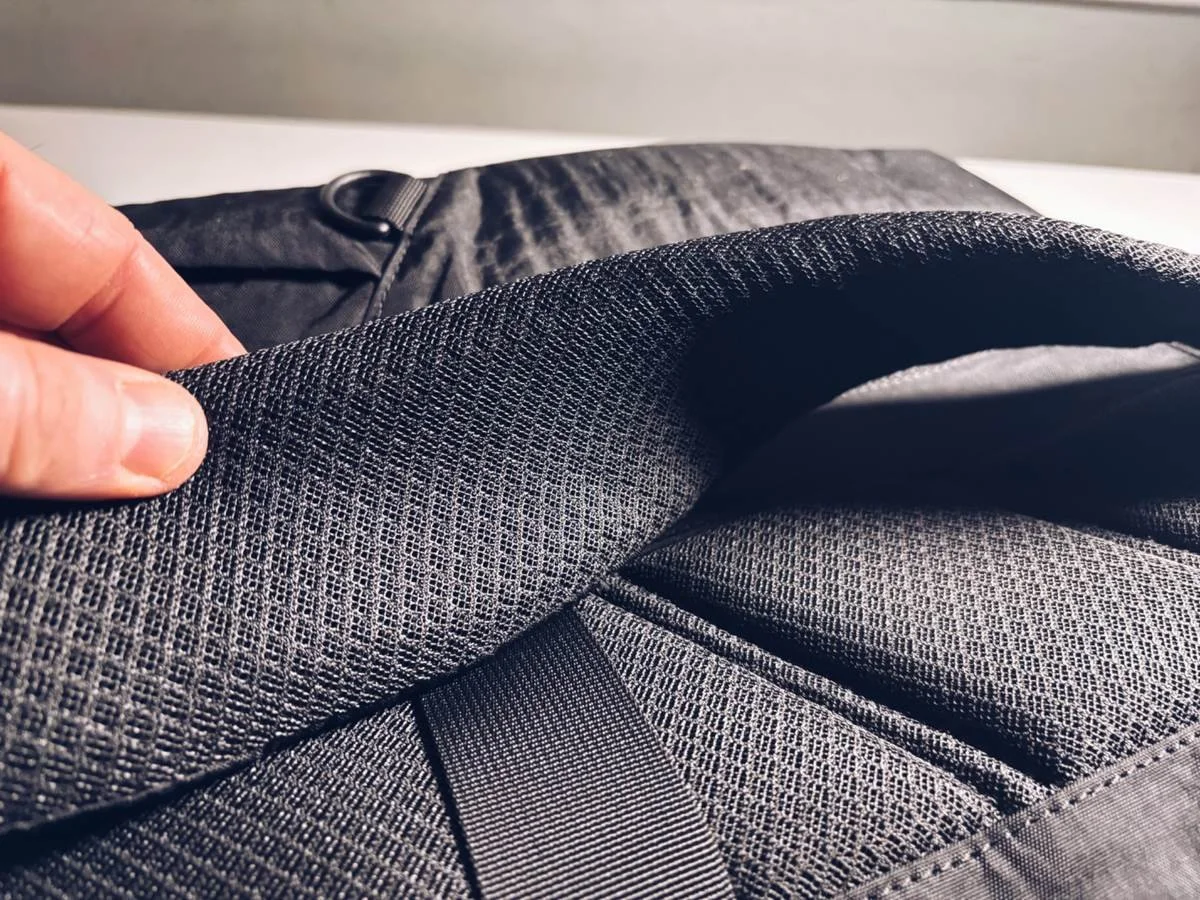 Close-up of the ADD1D D2D Essential Backpack mesh back panel showing the padded, ventilated material for comfortable everyday carry.
