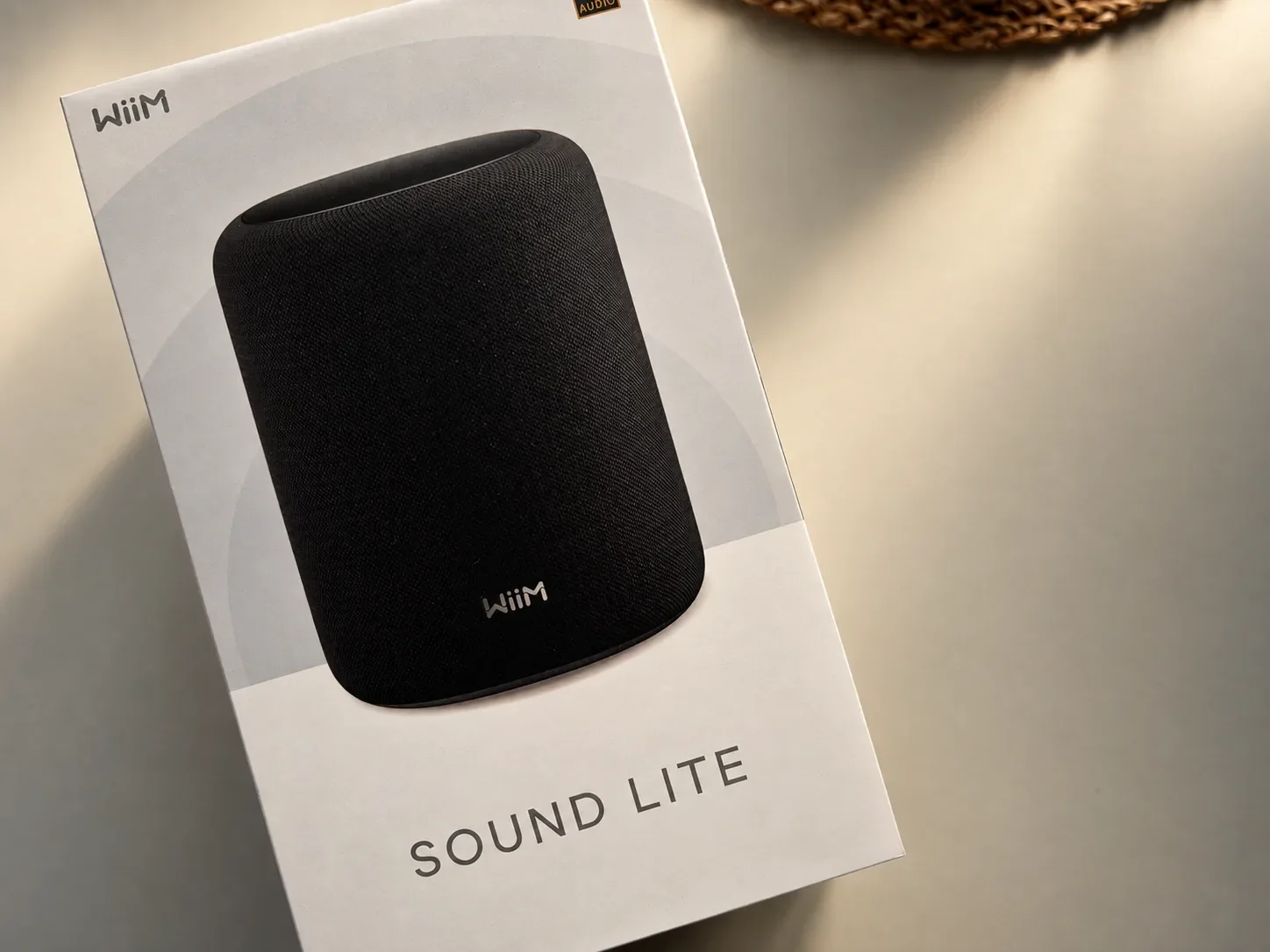 WiiM Sound Lite retail box showing the black wireless speaker