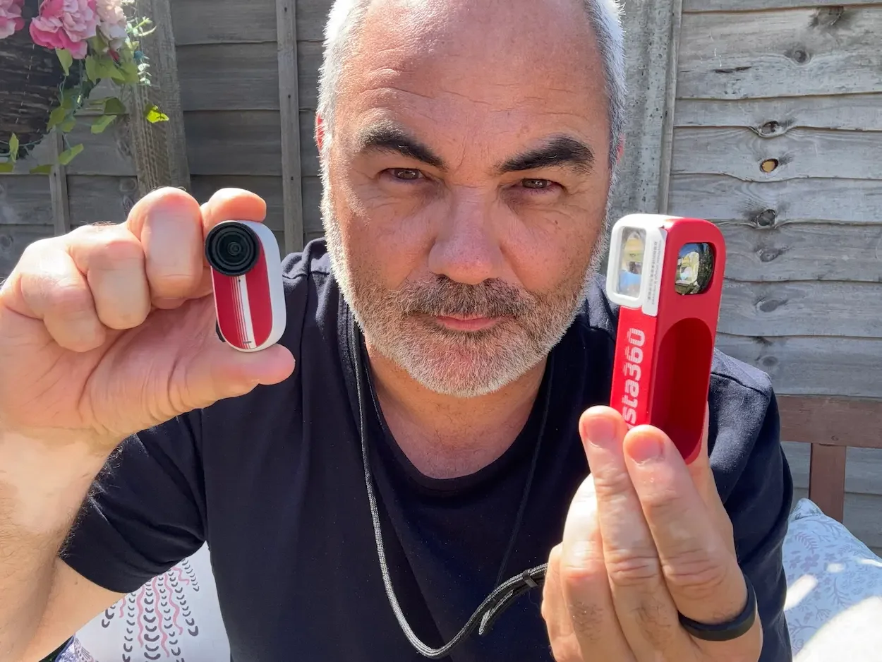 Jerome holding the tiny Insta360 GO 3S camera beside the red Retro Bundle Battery Pack