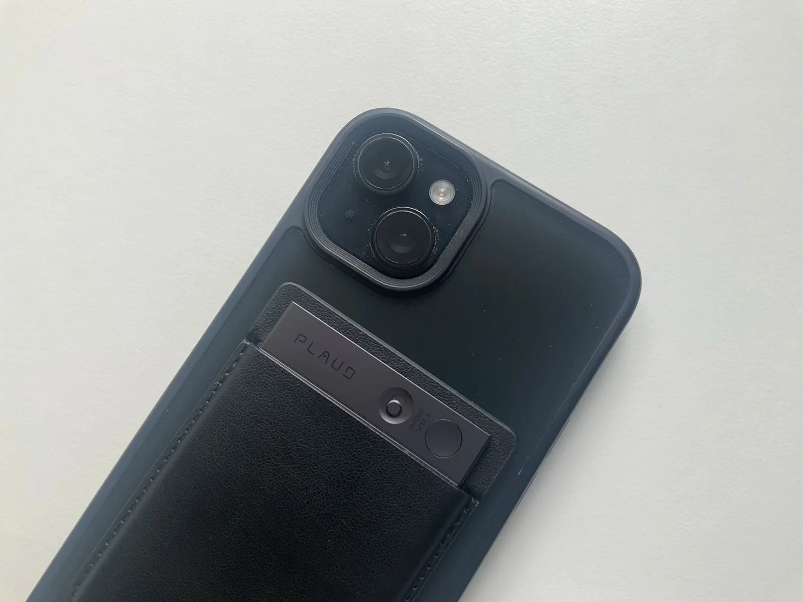 Plaud Note attached to an iPhone in a MagSafe-style case for AI note taking and phone call recording review