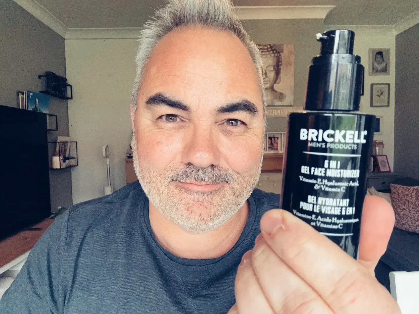 Jerome holding Brickell 6-in-1 Gel Face Moisturizer — best gel face cream for men tested by Dapper and Groomed
