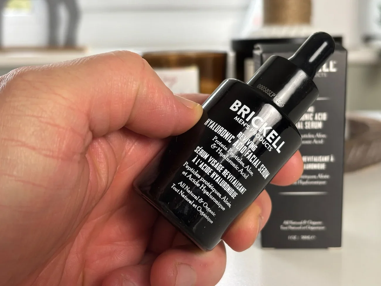Jerome showing a bottle of the Brickell Hyaluronic acid