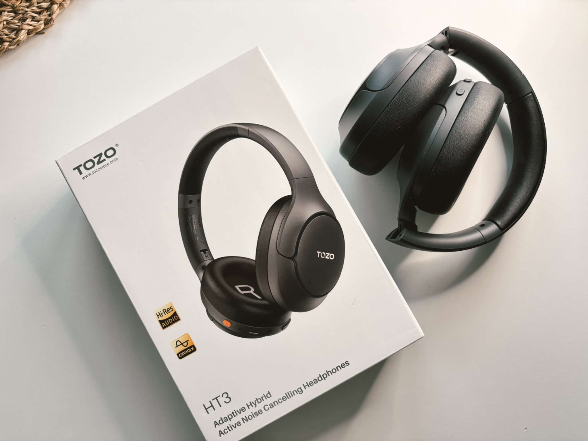 Hands-on unboxing of the TOZO HT3 headphones packaging showing the clean retail box.