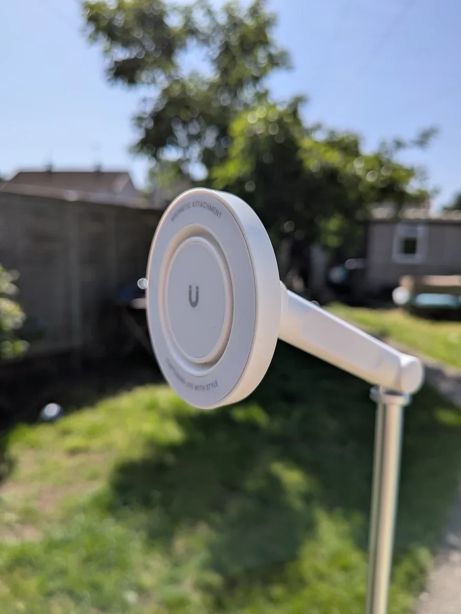 Close-up of the MagSafe magnetic mount on the KraftGeek JustTap Magnetic Phone Tripod during outdoor testing