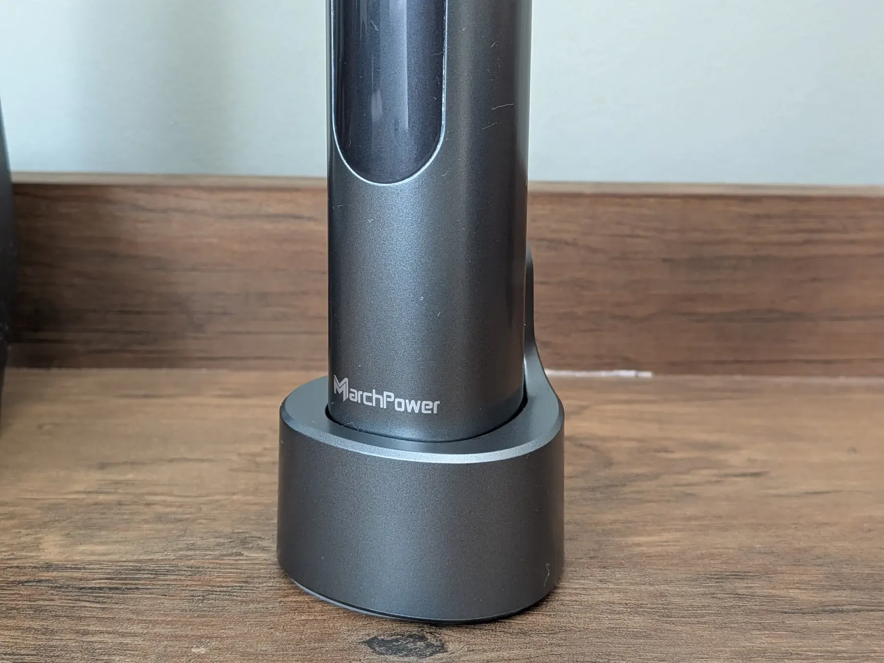 MarchPower 3-in-1 electric toothbrush placed on its USB-C powered charging dock.