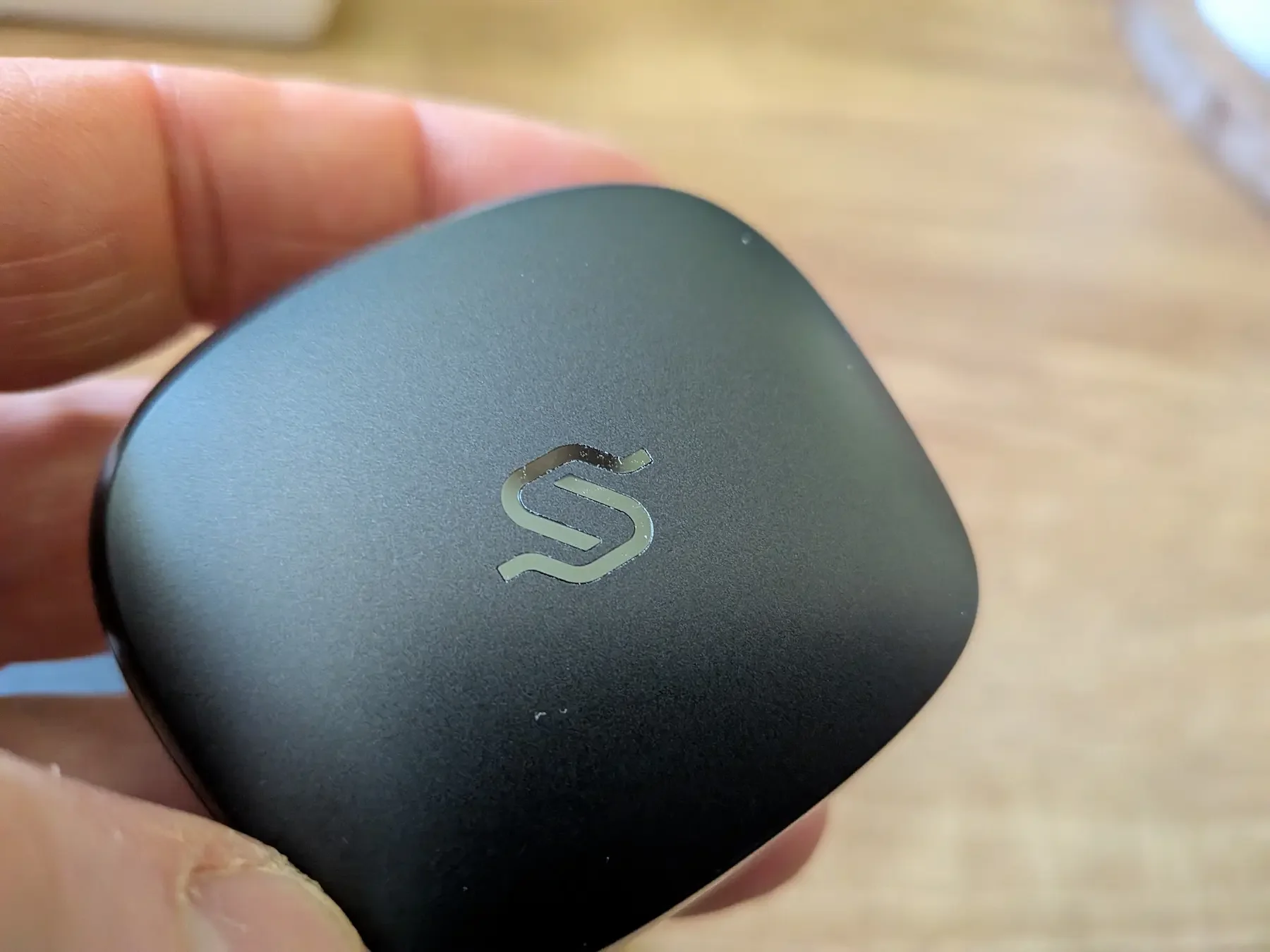 Close-up of the Edifier STAX Spirit S10 charging case lid with STAX logo