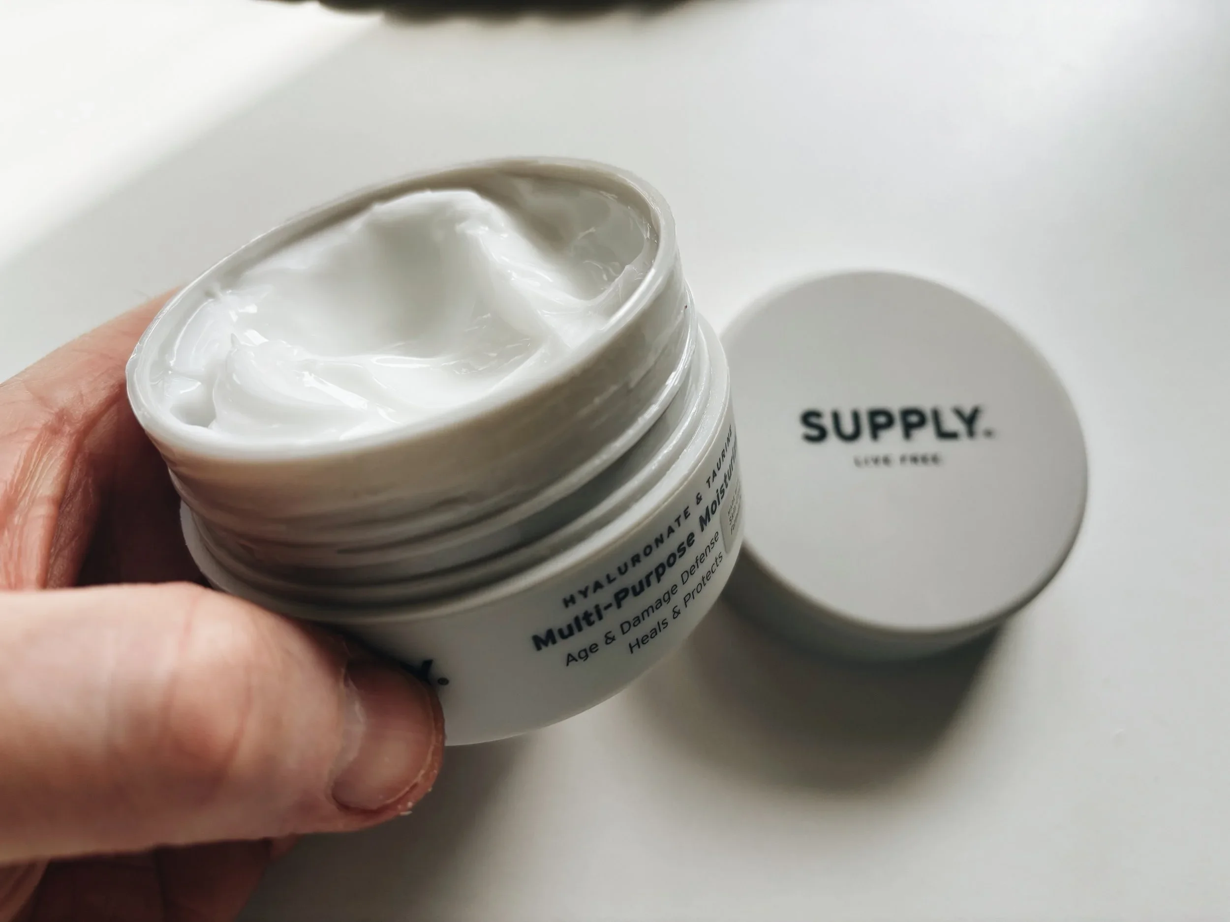 Open jar of Supply Multi-Purpose Moisturiser showing white cream texture — oil-free face cream for men reviewed by Jerome at Dapper and Groomed