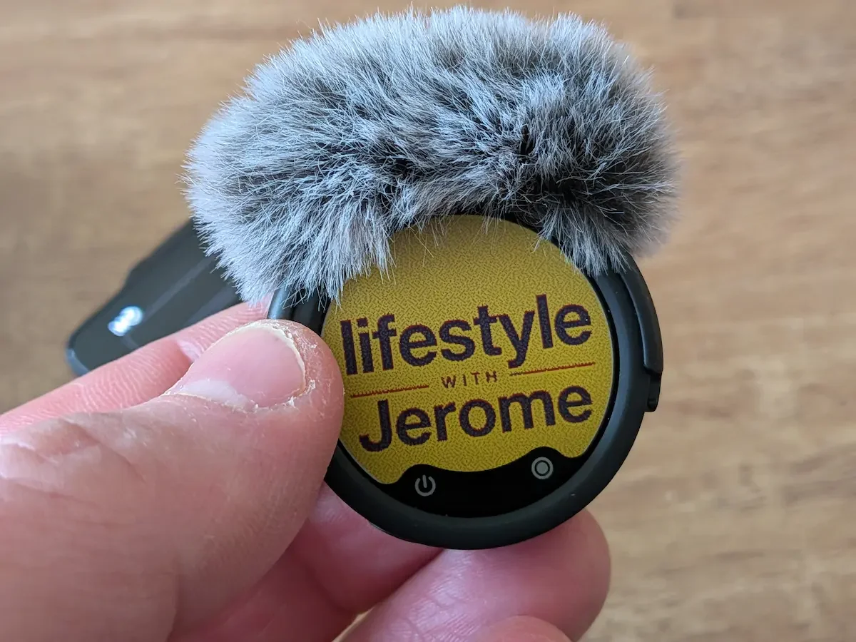 Close-up of the Insta360 Mic Pro personalised E-Ink display with a furry windshield attached.