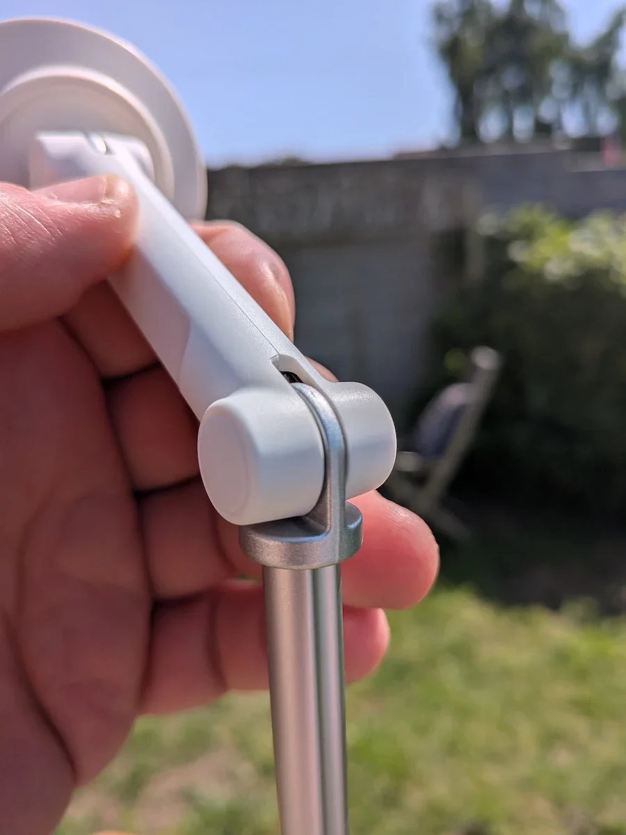 Close-up of the KraftGeek JustTap Magnetic Phone Tripod angle adjustment hinge during outdoor testing.