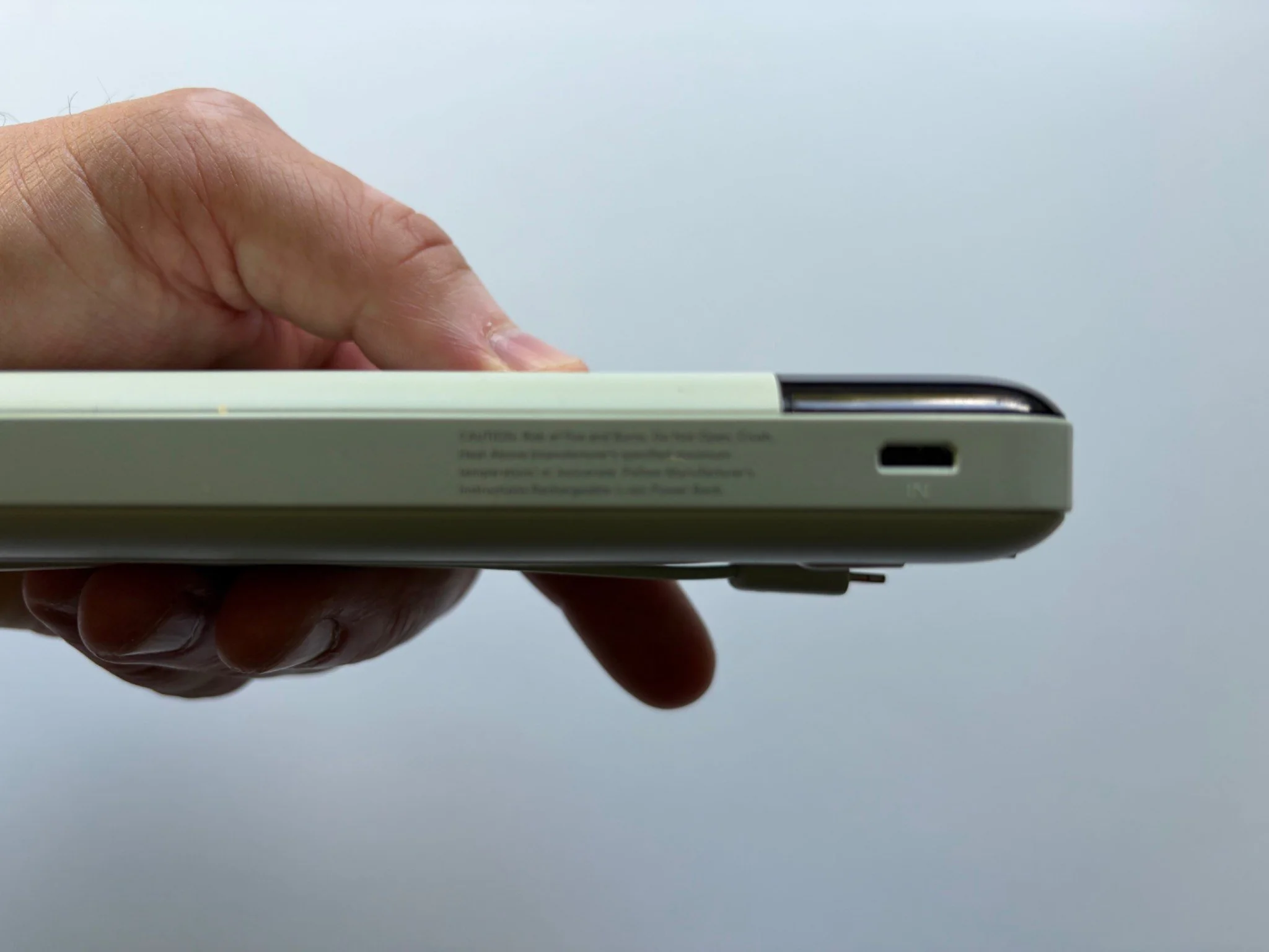 Side view of the Charmast 20000mAh power bank showing its slim profile and USB-C input.