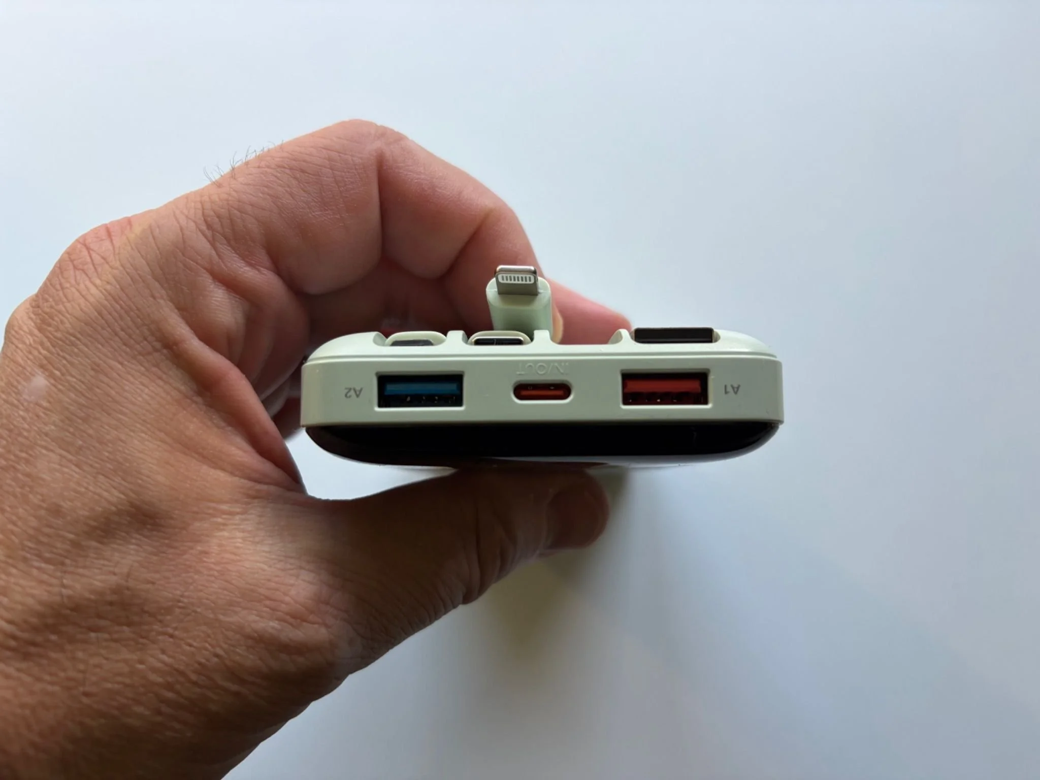Close-up of the USB-A and USB-C ports on the Charmast 20000mAh portable power bank.