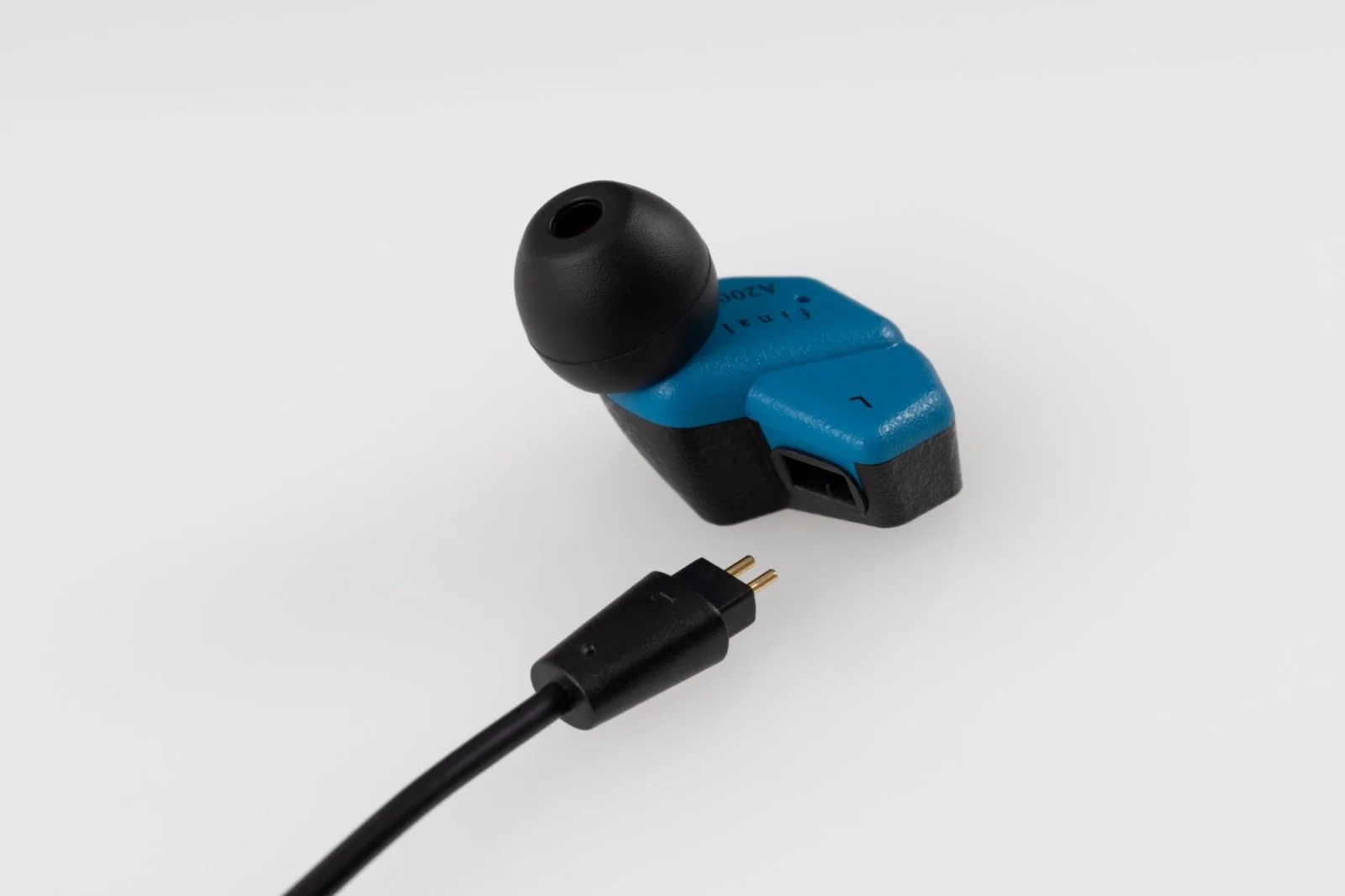 Close-up of Final A2000 earphone with detachable 2-pin connector