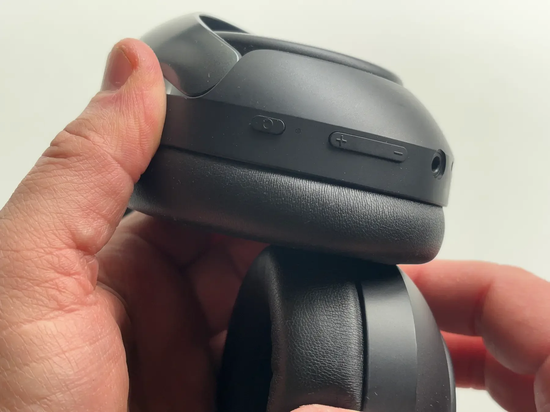 Close-up detail of the QCY H3 Pro headphones showing the ear cup controls, buttons, and overall build quality in Jerome’s hands-on review.
