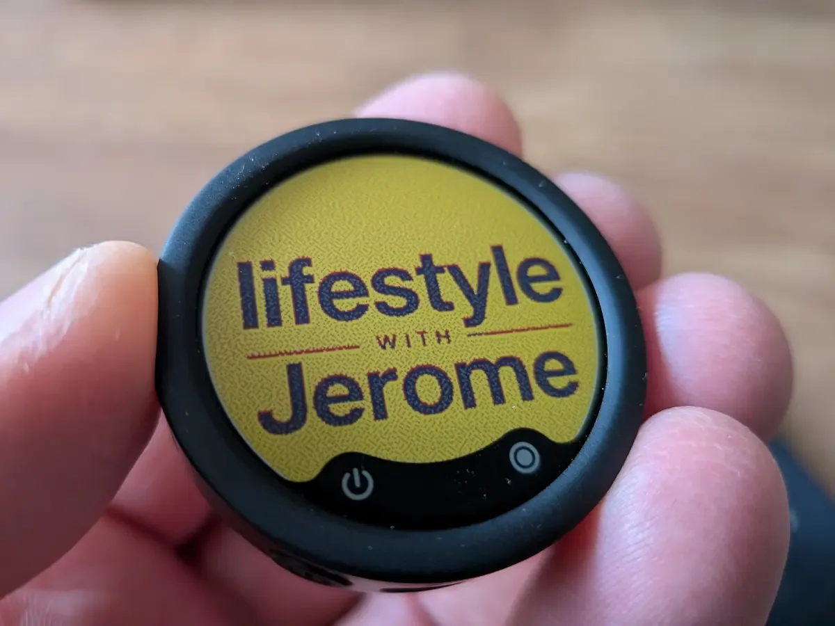 Close-up of the Insta360 Mic Pro personalised E-Ink display showing the Lifestyle with Jerome logo.
