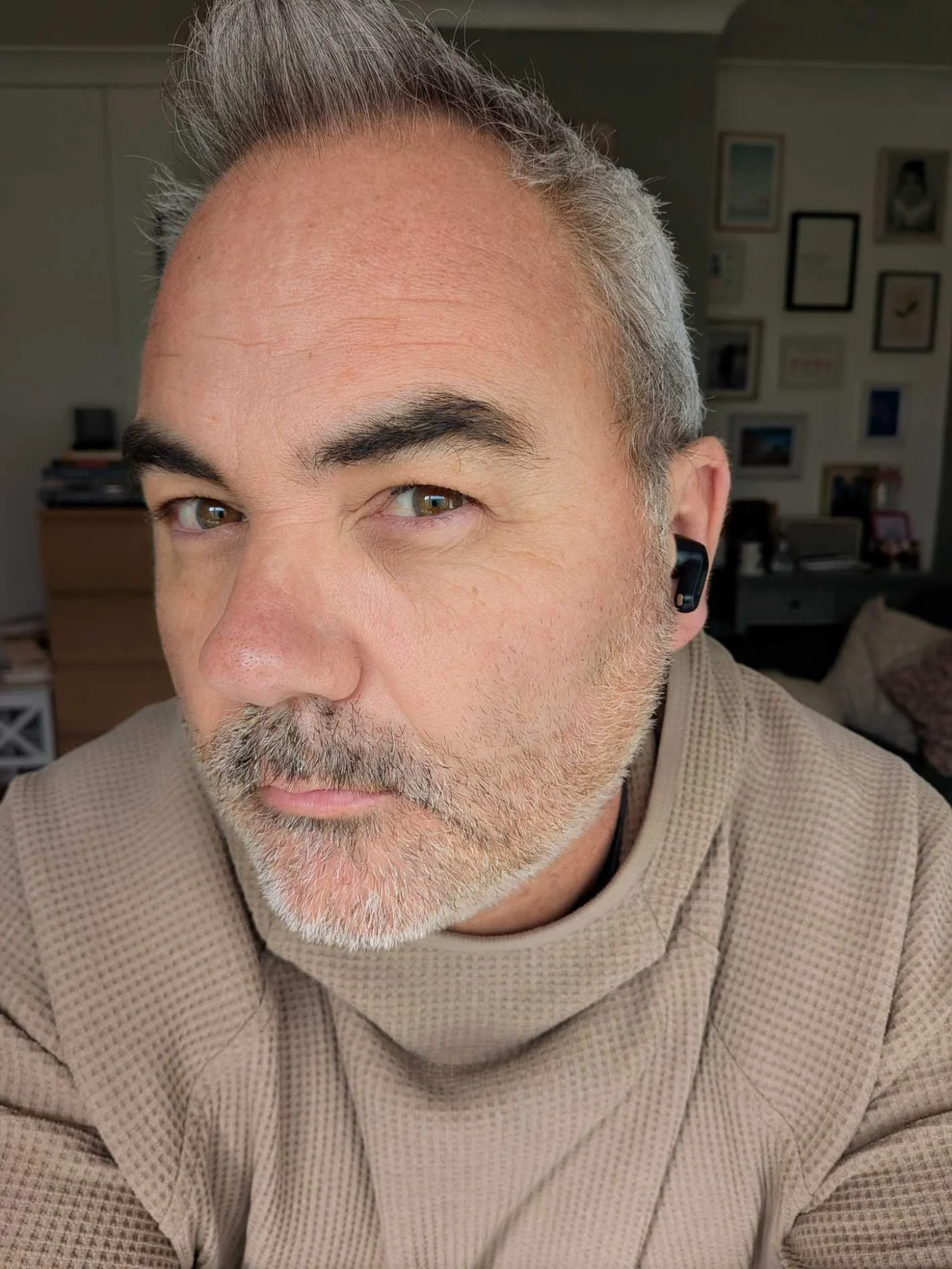 Jerome wearing the TOZO NC20 Pro earbuds during real-world testing, showing the in-ear fit and everyday look of the earbuds.