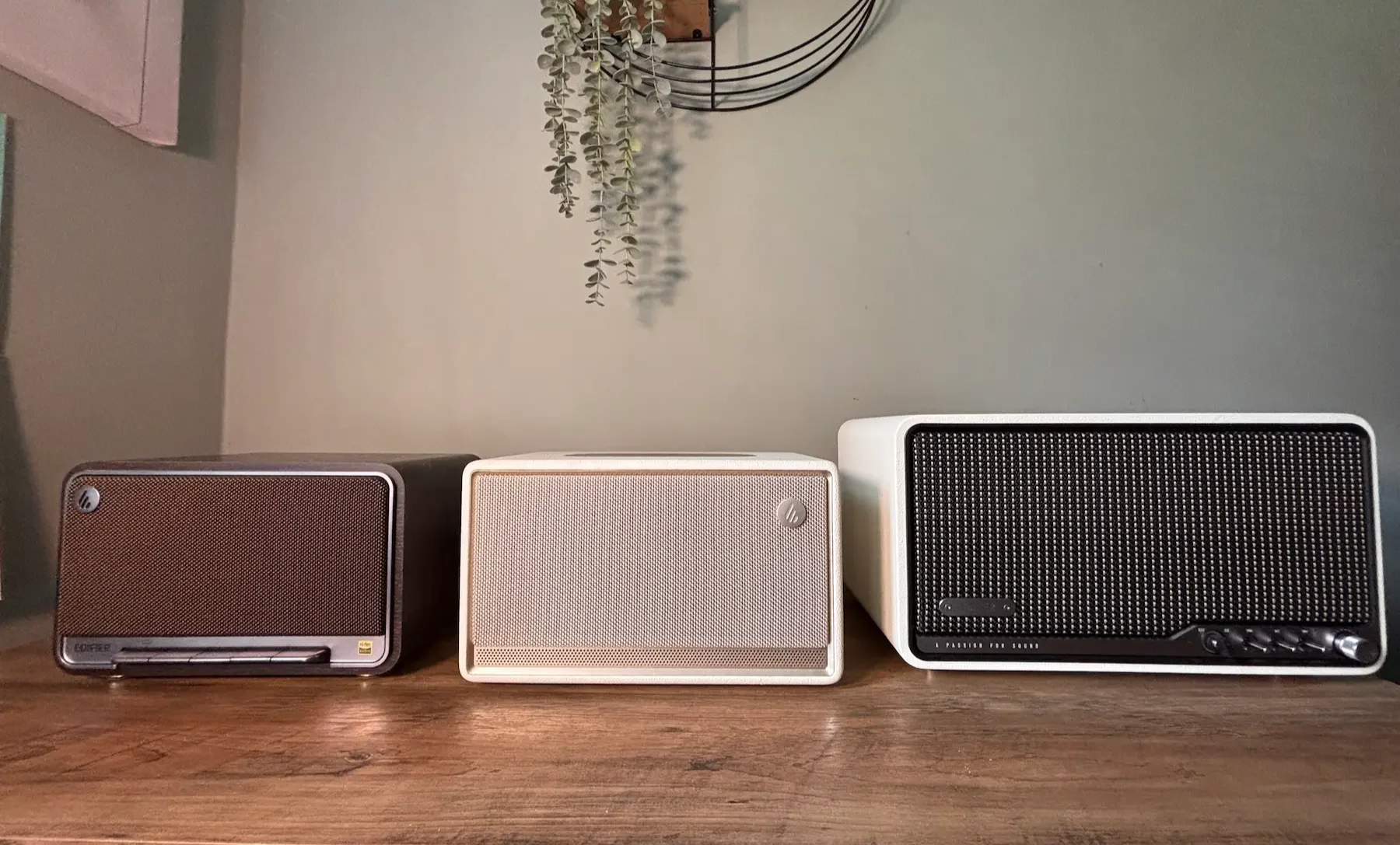 Edifier ES300, Edifier S300 and Edifier D32 speakers compared side by side on a wooden table