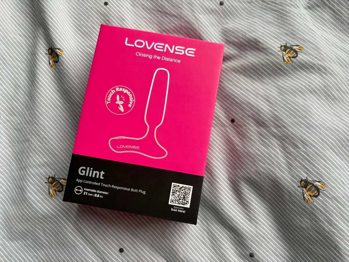 Lovense Glint vibrating butt plug retail packaging showing the touch-responsive feature.