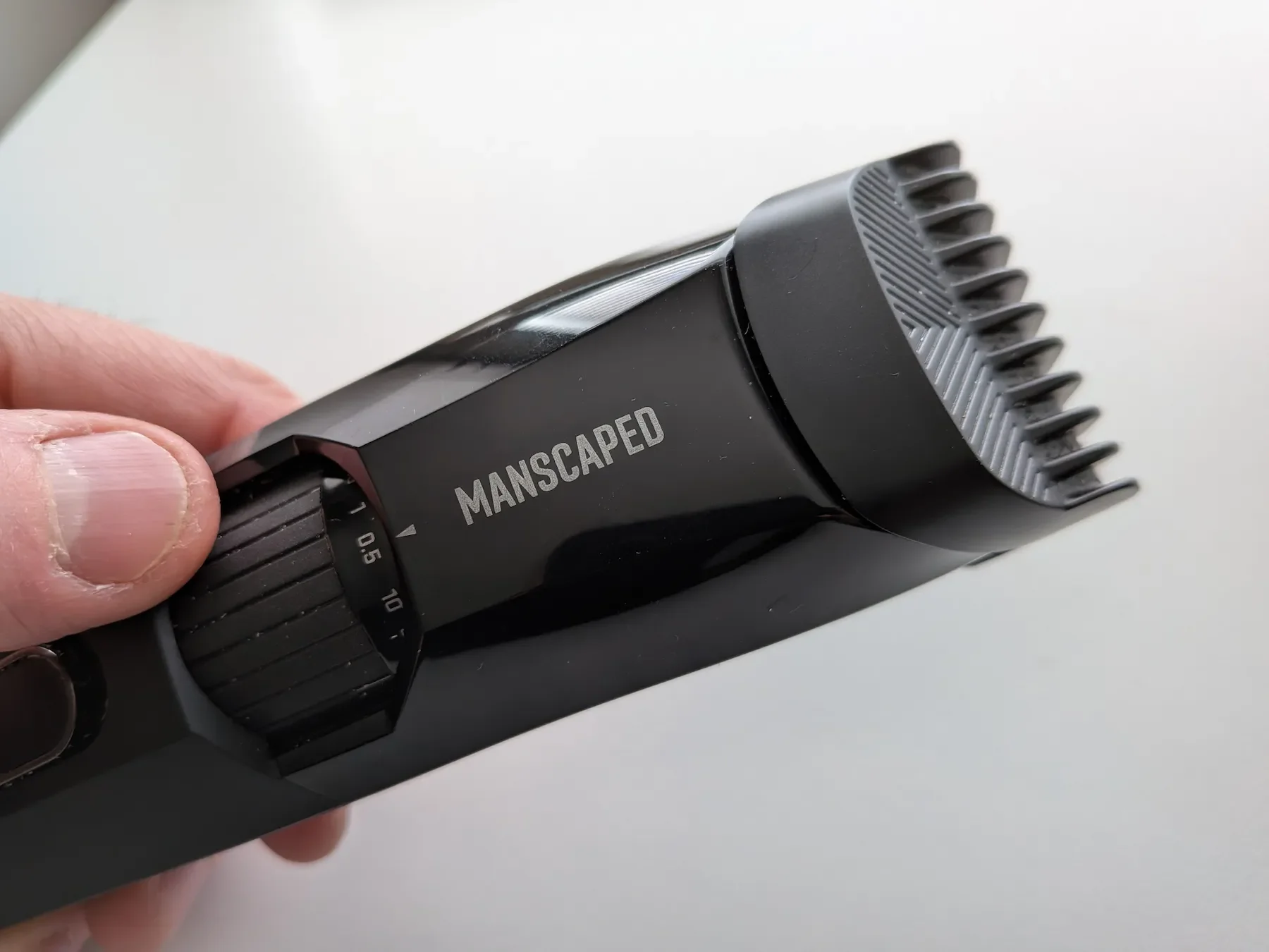 Close-up of the Manscaped Beard Hedger zoom wheel showing 0.5mm to 10mm length settings