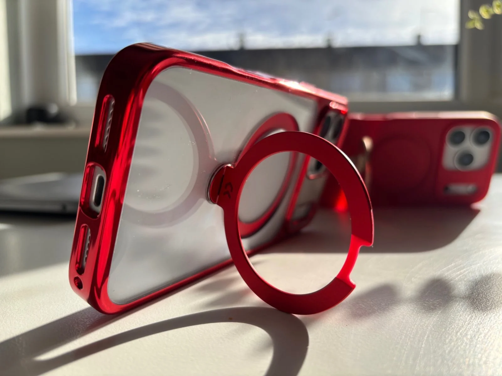 Side angle of CASEKOO iPhone 17 Pro Max Spin Magnetic Stand Case showing extended metal ring stand