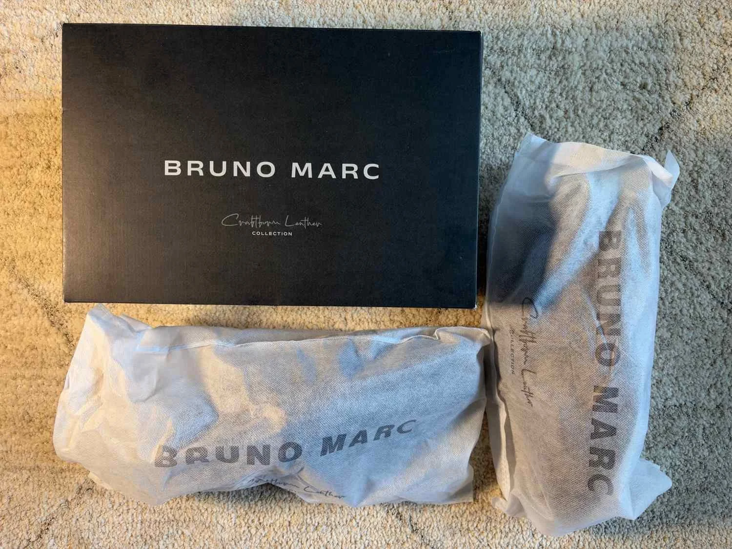 Bruno Marc Crafture Leather Collection black shoe box with two individually branded protective shoe bags.