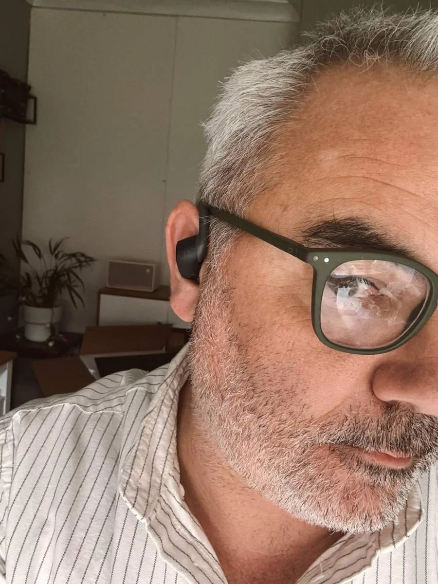 TOZO OpenWear open-ear earbuds fit on ear close-up