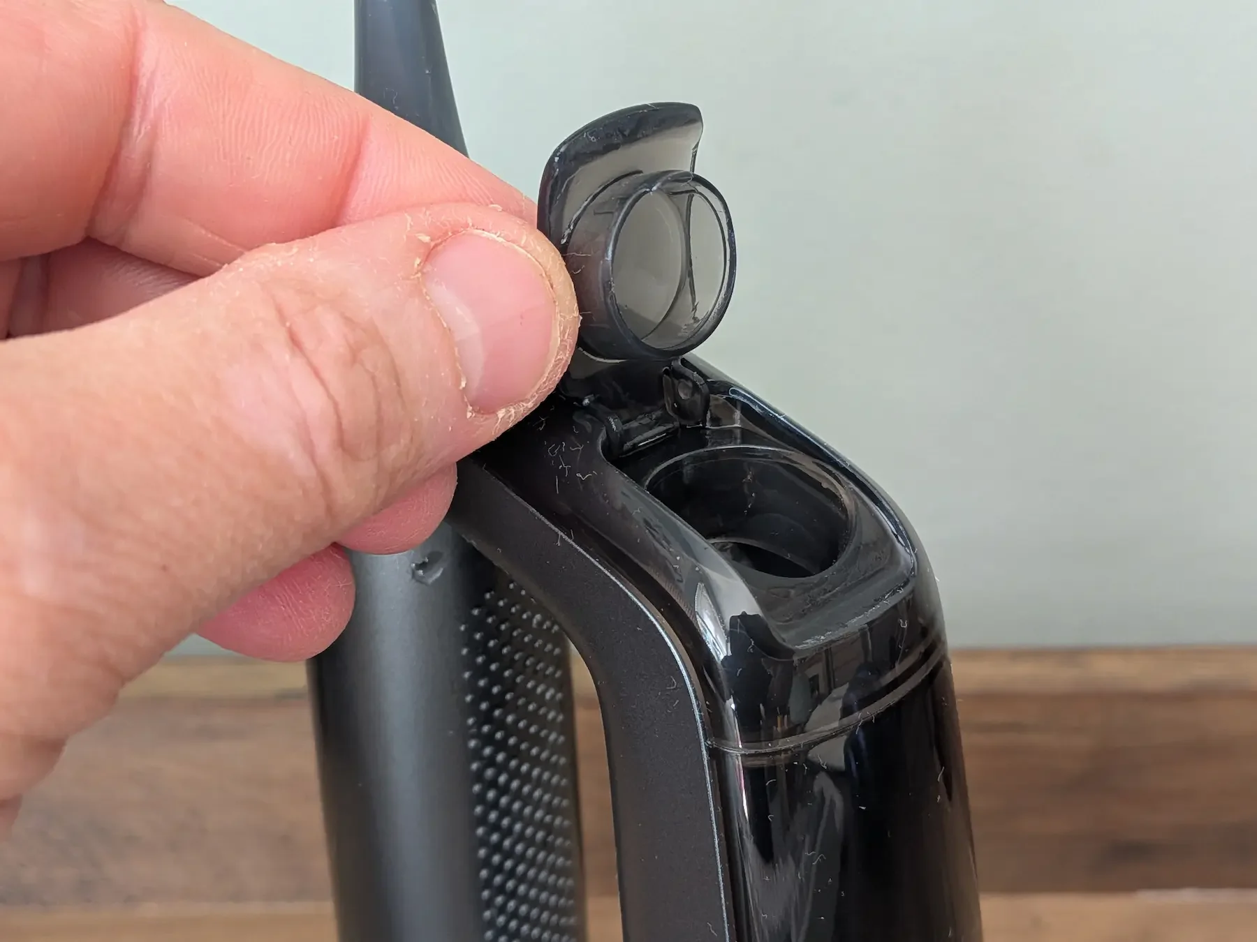 Close-up of the MarchPower 3-in-1 removable water tank opening for the built-in water flosser.