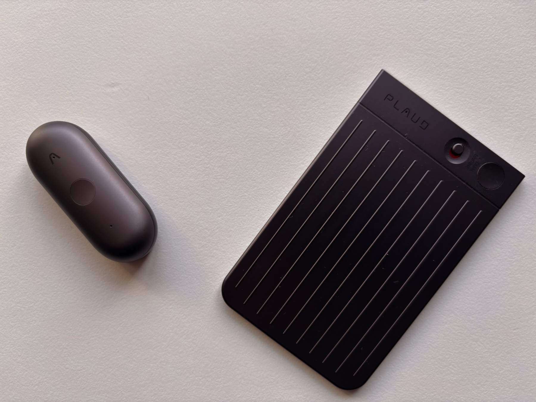 PLAUD NotePin S next to the PLAUD Note voice recorder, showing the two devices side by side.