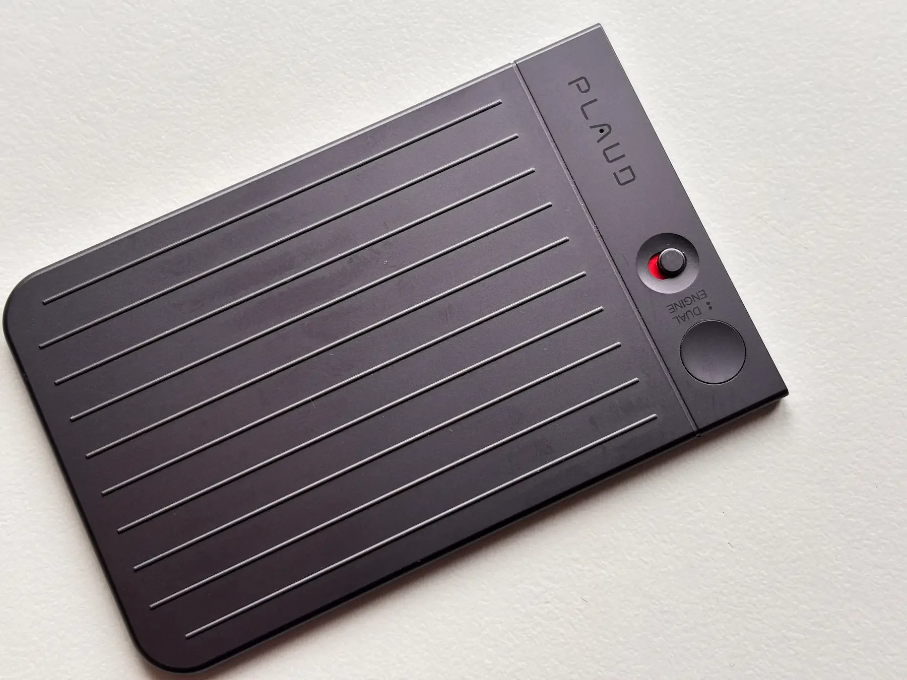 Close-up of the original Plaud Note showing its simple design and manual mode switch