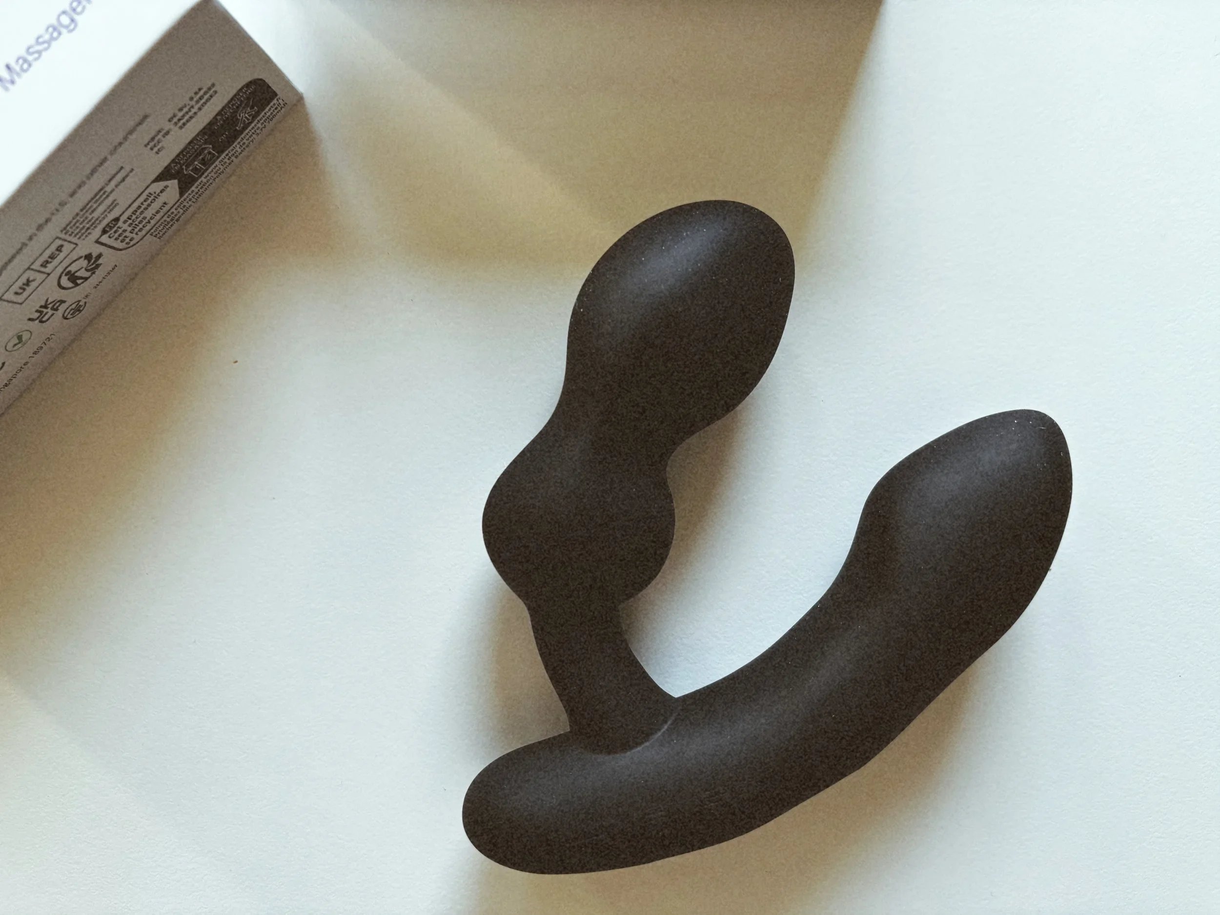 Lovense Edge 2 unboxed on a white table