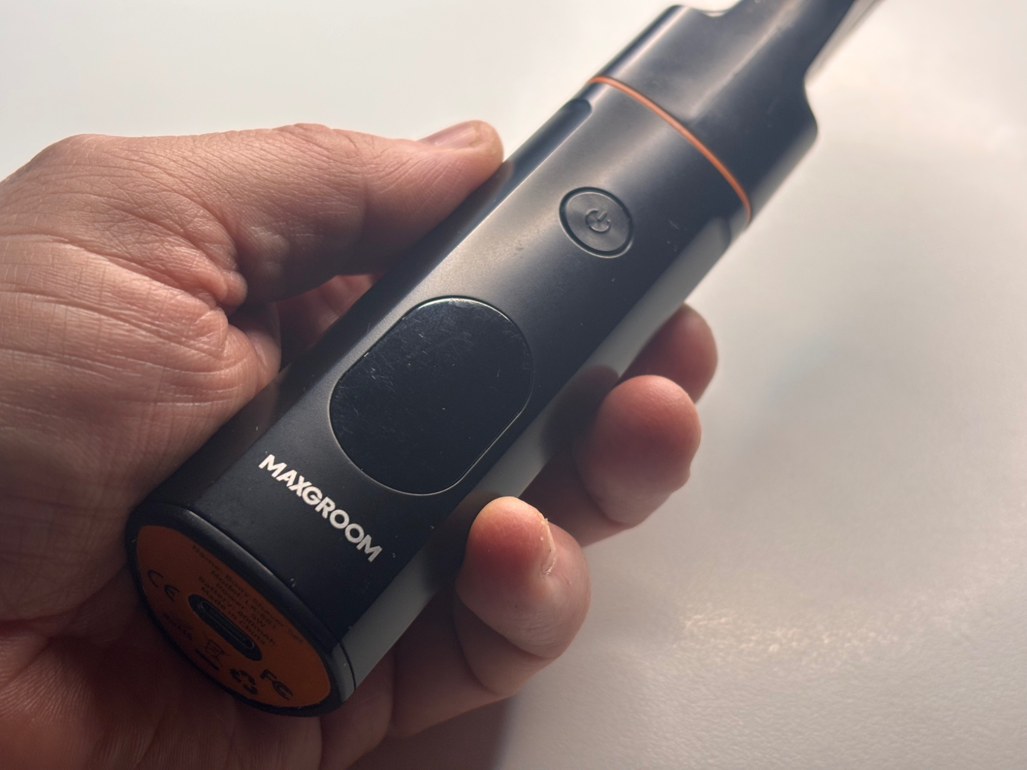 maxgroom-body-hair-trimmer-in-hand.png