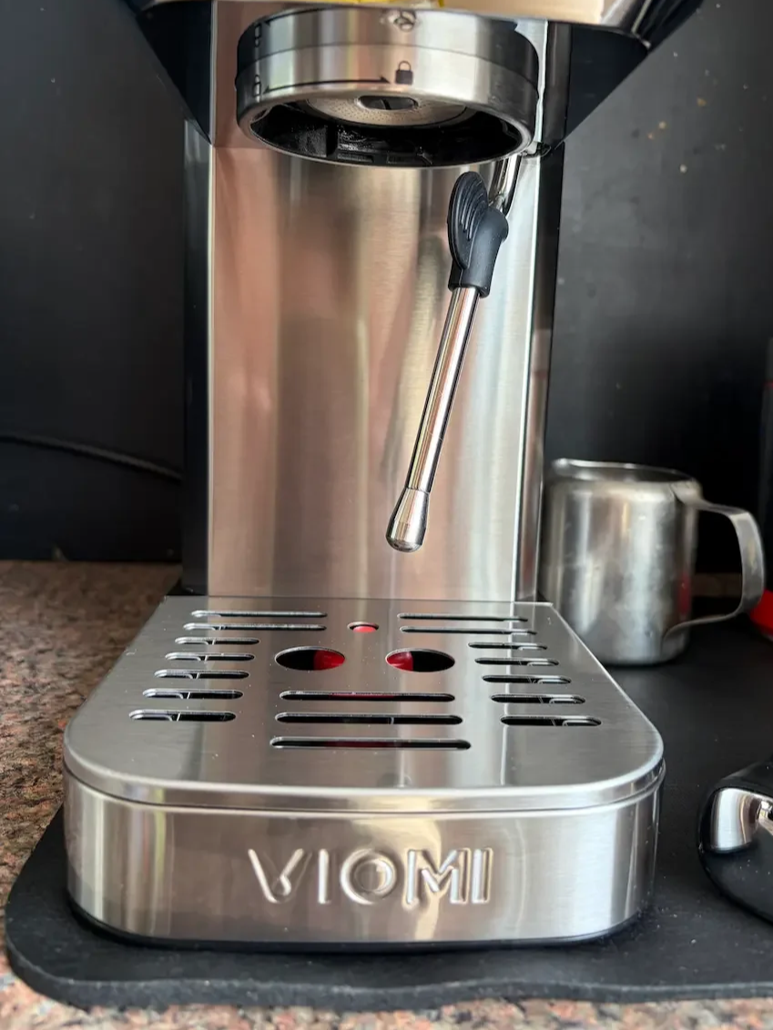 Front view of the VIOMI T1A Pro showing the steam wand, drip tray and portafilter