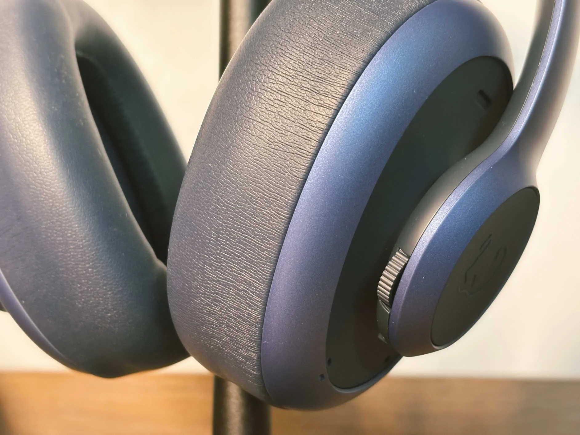 Macro shot of the Fresh ’n Rebel Clam Ace 2 earcup with the volume wheel and textured ear pad.