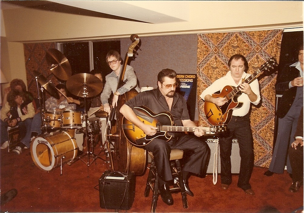 Tommy Tedesco sitting on the stool, on guitar