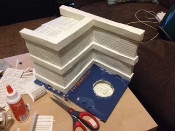 Completely questioned my decision to build on top of the book cover. She is jumping into the book. And it gives nice contrast. It is also a different approach from my past sculptures. 