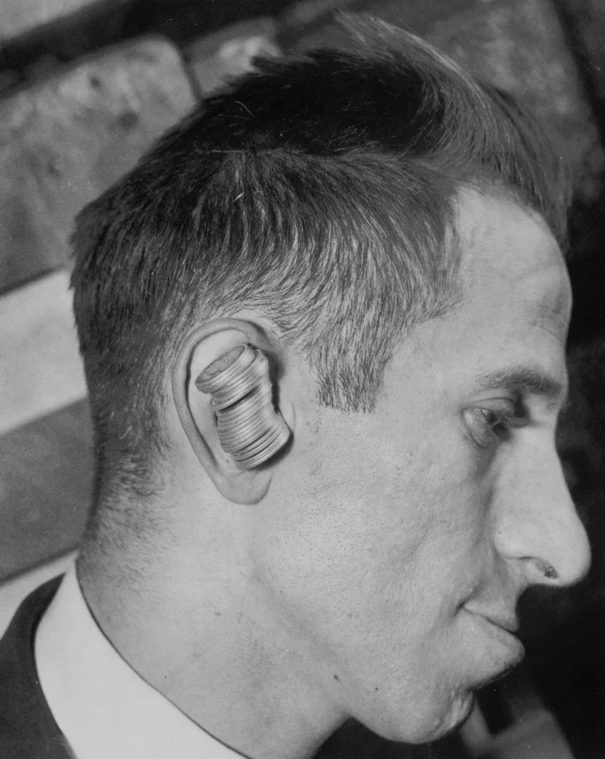 Brooklyn's Max Calvin never needed to fish for change. He could hold twenty-five quarters in his ear! (July 15, 1933)